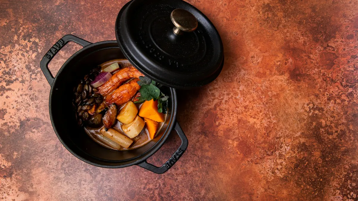 black cooking pan with food